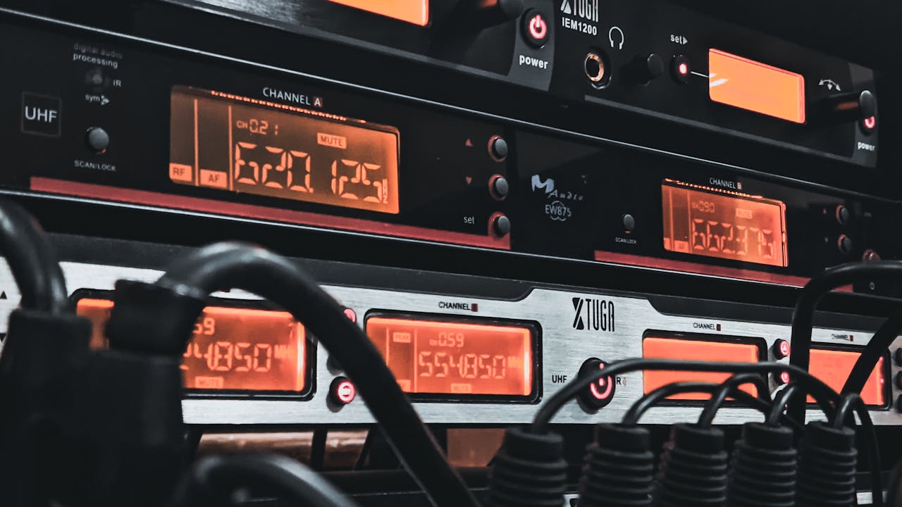 our-experience Detailed view of audio equipment and cables, perfect for sound engineering and recording themes.