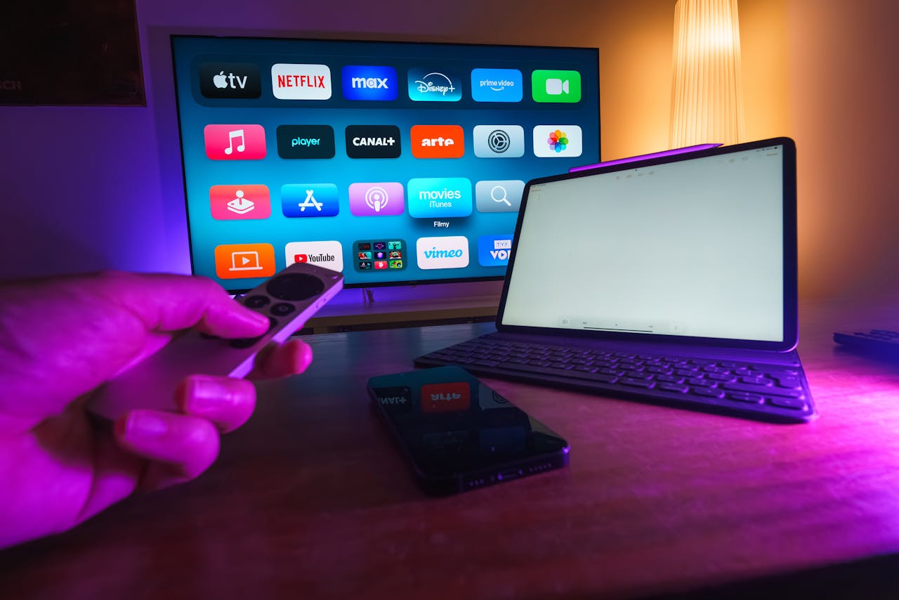about-img A cozy home setup featuring streaming services on smart TV, tablet, and smartphone.
