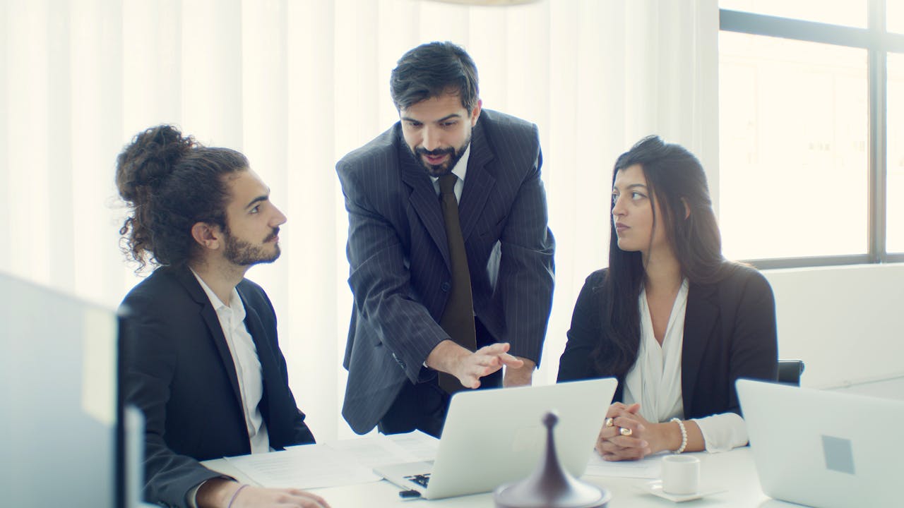 Professional team in office discussing a business project with focused collaboration.